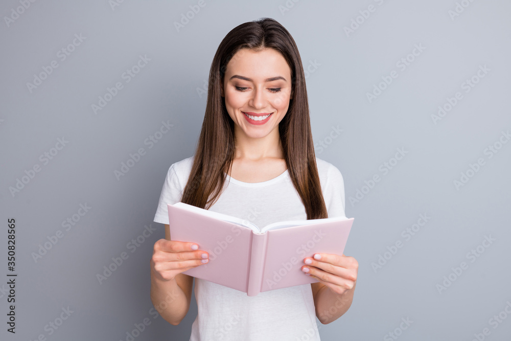 Portrait of cheerful high school girl have covid-19 quarantine distance study read notebook diary wear trendy summer outfit isolated over gray color background Portrait of cheerful high school girl have covid-19 quarantine distance study read notebook diary wear trendy summer outfit isolated over gray color background