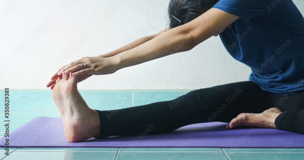 woman in meditating yoga instructor. sitting on lotus pose at home. Yoga concept.healthy lifestyle concept.