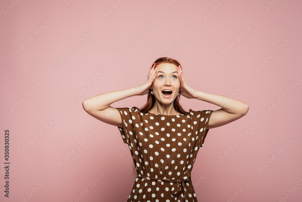Dynamic image of caucasian female model on pink studio background. Winning success happy woman celebrating being a winner. Victory, delight concept. Human facial emotions concept Dynamic image of caucasian female model on pink studio background. Winning success happy woman celebrating being a winner. Victory, delight concept. Human facial emotions concept