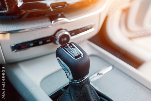 Automatic transmission gear, car interior close up.