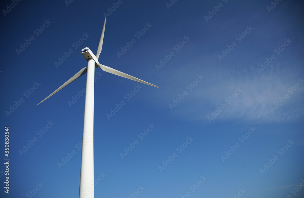 wind turbine against blue sky