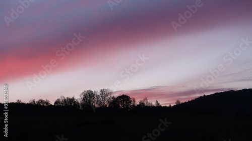 Mystic evening sky scenery over a mountaintop in germany