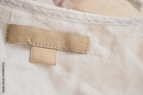 blank clothing label on fabric texture background