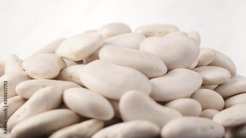 Bean grains of spin around themselves on white background Bean grains of spin around themselves on white background