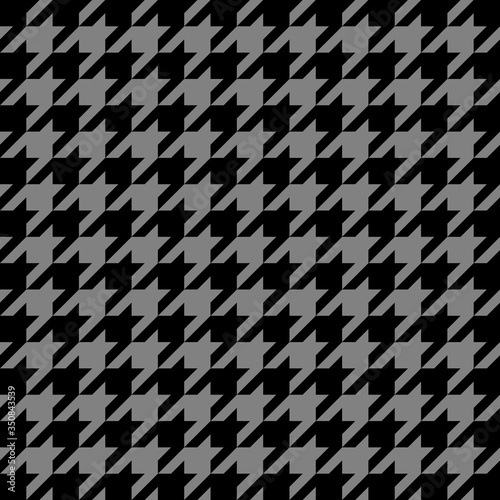 Halloween goose foot. Pattern of crow's feet in black and gray cage. Glen plaid. Houndstooth tartan tweed. Dogs tooth. Scottish checkered background. Seamless fabric texture. Vector illustration