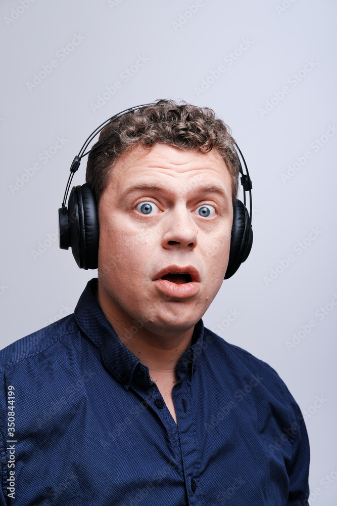 Studio portrait of rocker musician in headphones Studio portrait of rocker musician in headphones