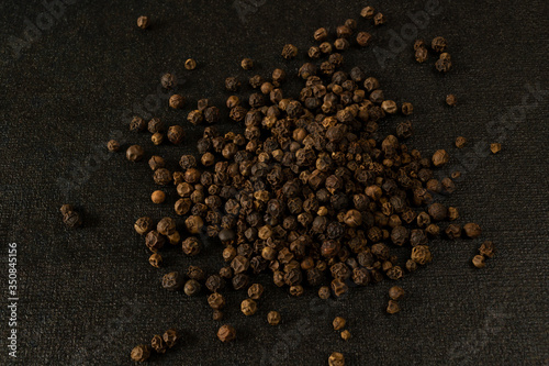 spices, pepper close-up on black background