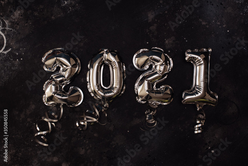 Golden Christmas 2021 balloons isolated on white background. Helium balloons, gold foil numbers. Numbers for Happy New Year 2021. Party decoration, anniversary sign for holidays, celebration, carnival
