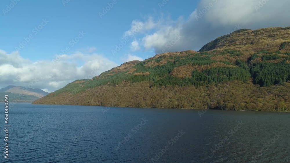 Ben Lomand, Scotland revealed from Loch Lomand water level to aerial high perspective Ben Lomand, Scotland revealed from Loch Lomand water level to aerial high perspective