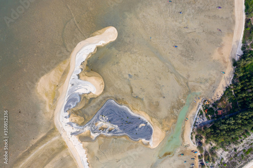 Aerial view of a large sandbar at low tide on a tropical ocean (Pakarang Cape, Khao Lak, Thailand) photo