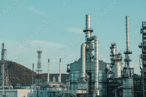 Oil and gas industrial, Oil refinery plant from industry, Refinery Oil storage tank and pipe line steel with blue sky.