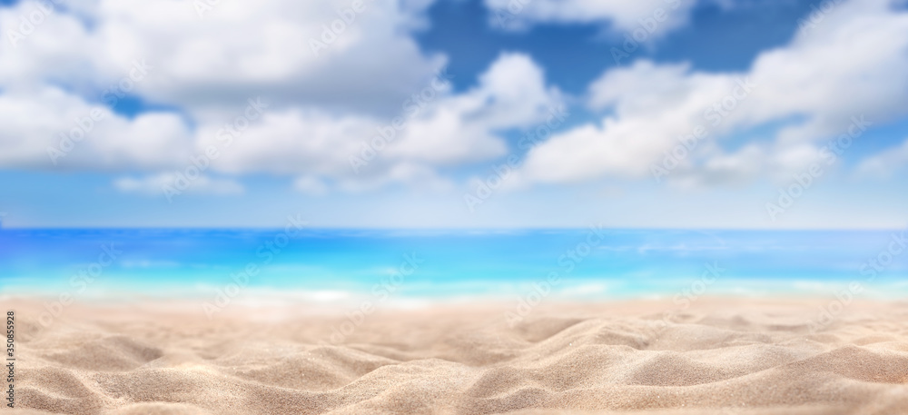 A summer vacation, holiday background of a tropical beach and blue sea and white fluffy clouds.