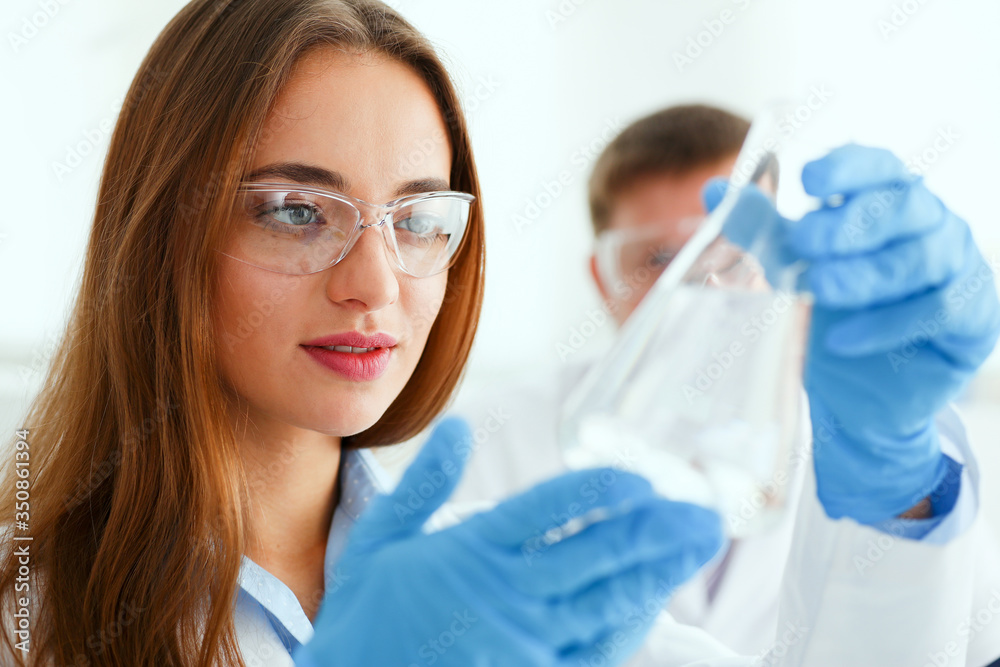 Fototapeta premium Female technician arms in protective gloves
