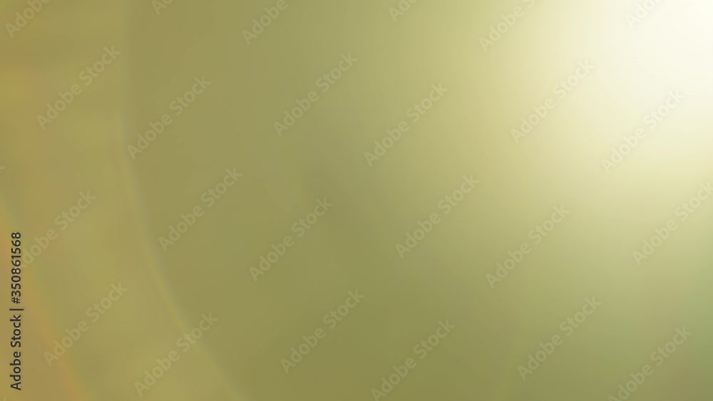 Warm lens flares in motion. Beautiful gold light visual effects for transitions or overlays