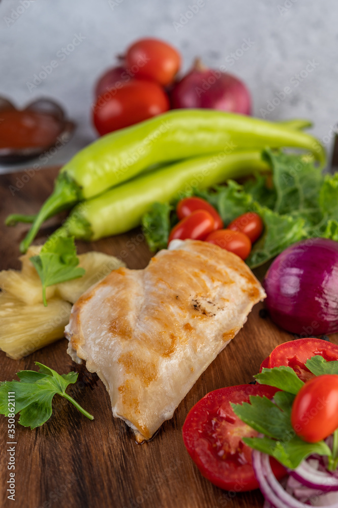 Chicken steak placed on a wooden tray. Chicken steak placed on a wooden tray.
