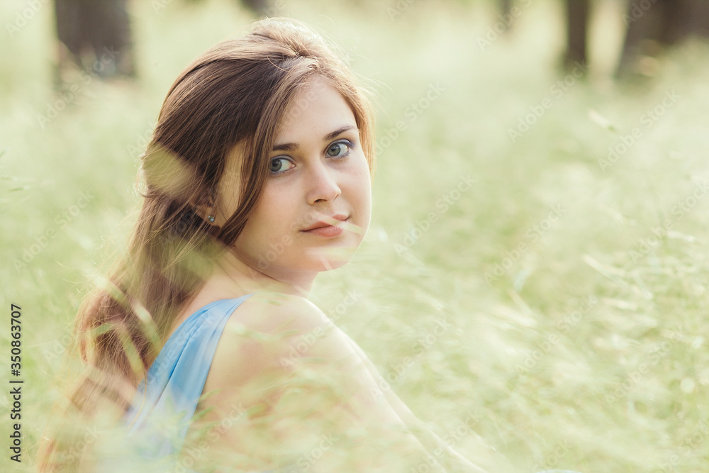 beautiful romantic girl sitting on field of spikelets and enjoying nature, young elegant woman walking beautiful romantic girl sitting on field of spikelets and enjoying nature, young elegant woman walking