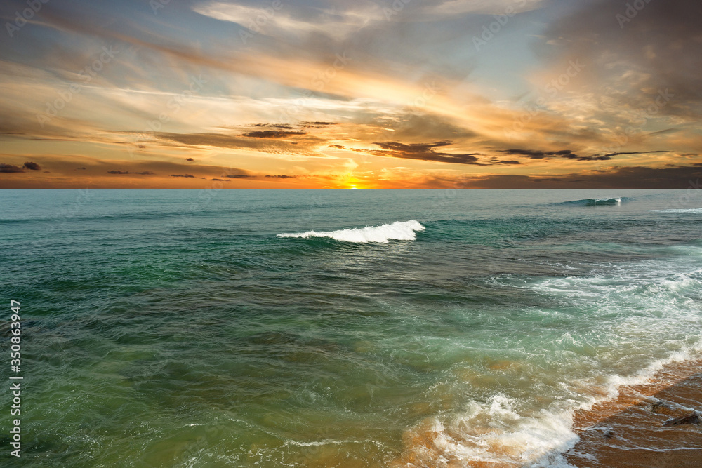 Indian ocean view, Sri Lanka, sea waves with dramatic sunset