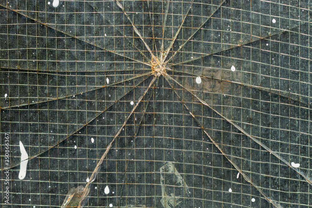 Detail of  a cracked window in an industrial building