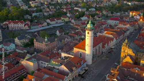 Aerial view to historic center of Domazlice city in sunset. Medieval town was first recorded as a town in 1231. Beautiful destination in Western Bohemia. Czech Republic, Central Europe. photo