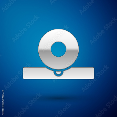 Silver Otolaryngological head reflector icon isolated on blue background. Equipment for inspection the patient's ear, throat and nose. Vector