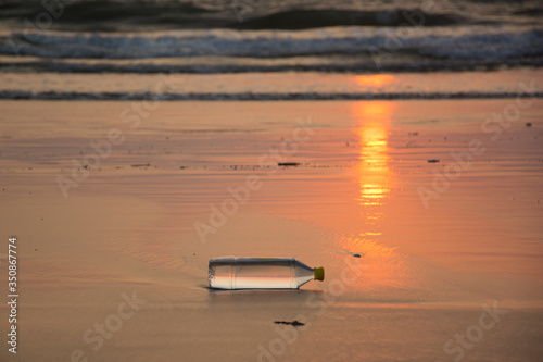 A plastic water bottle disposed off at the beach