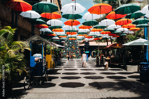 Port Louis, Mauritius, Covered with umbrellas walk along the promenade Leodan in the capital