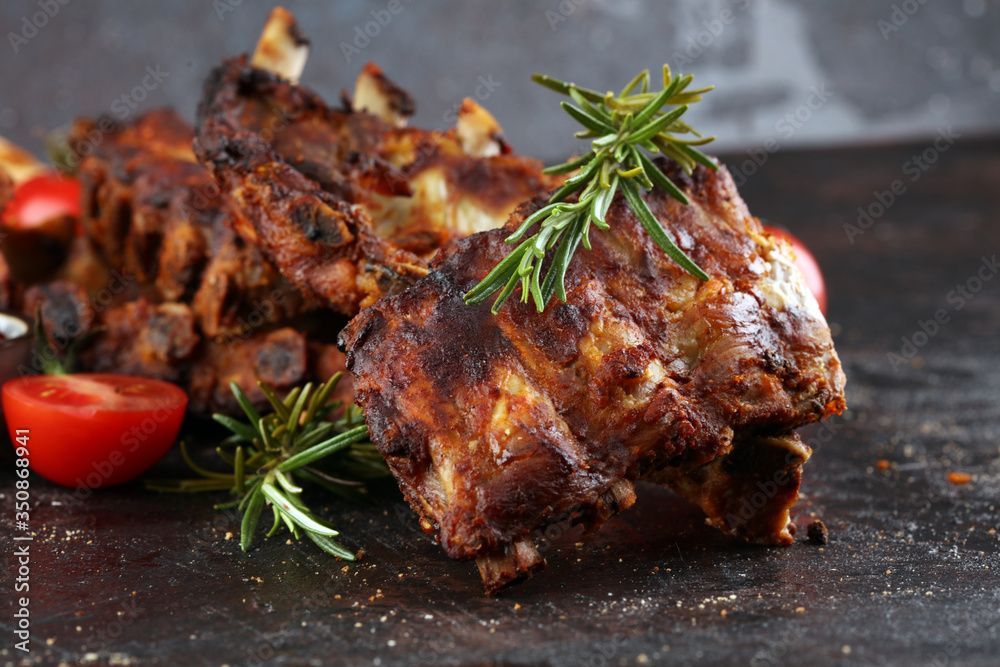 Grilled spare ribs for a tasty bbq meat with hot spicy barbecue sauce
