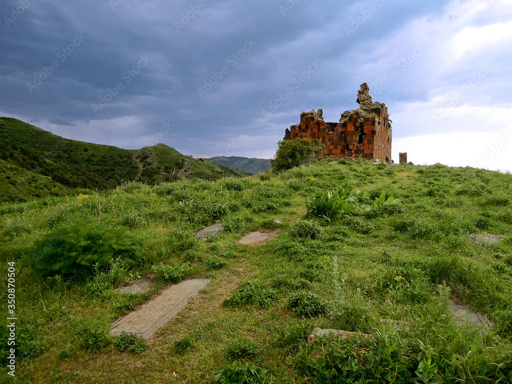 Panoramic view on the abandoned ruins of the medieval church Amenaprkich in the monastic complex Havuts Tar, ruined during the earthquake, Khosrov State Reserve, near the village Garni, Armenia