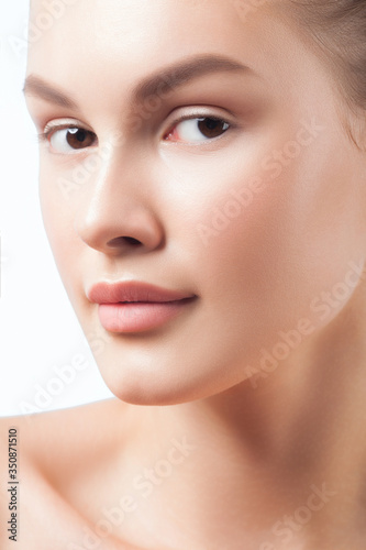 Young beautiful woman with clean perfect skin close-up