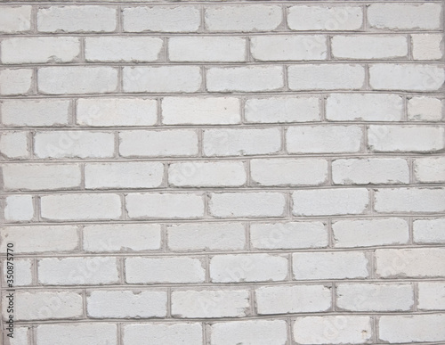  Texture of a white brick wall on an old house as a background
