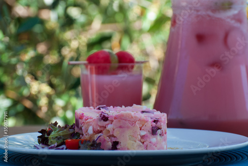 potato, egg and beet salad. accompanied by watermelon juice