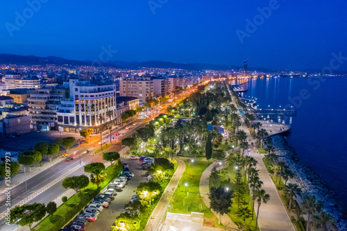 Island of Cyprus. Evening in Cyprus. Mediterranean coast in the area of Limassol. Panorama of evening Limassol from a height. Molos embankment is lit by evening lights. Holidays in Cyprus. photo