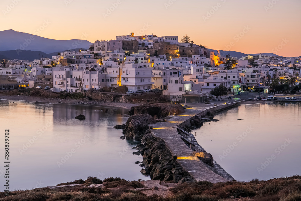 Romantic and peaceful scenery on greek town Naxos ar dawn. Concept of tranqulity, silence, magic, romantic place. Luxury travel destination.