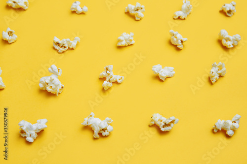 Popcorn pattern on yellow background. Top view. Entetainement concept.