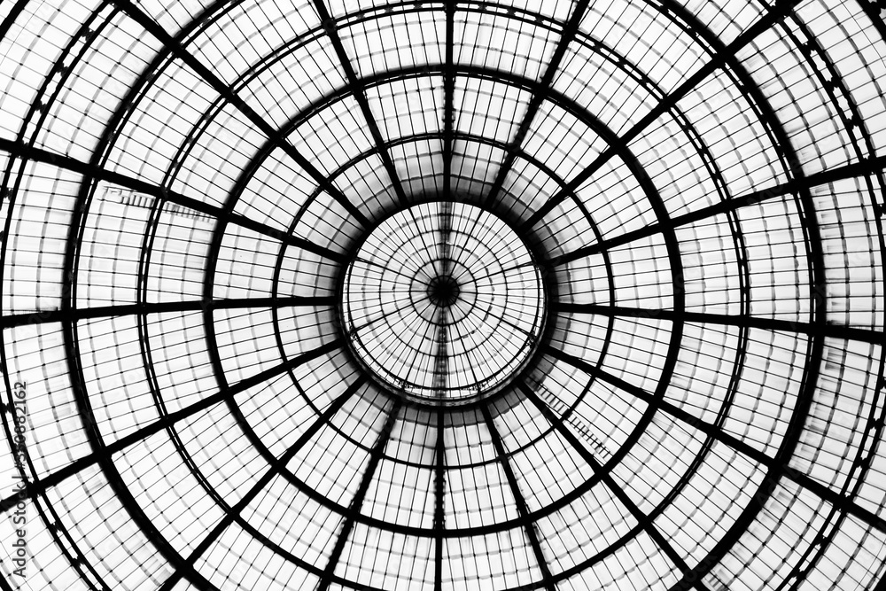 Look up at glass dome in the Galleria Vittorio Emanuele II in Milan. Geometric detail.