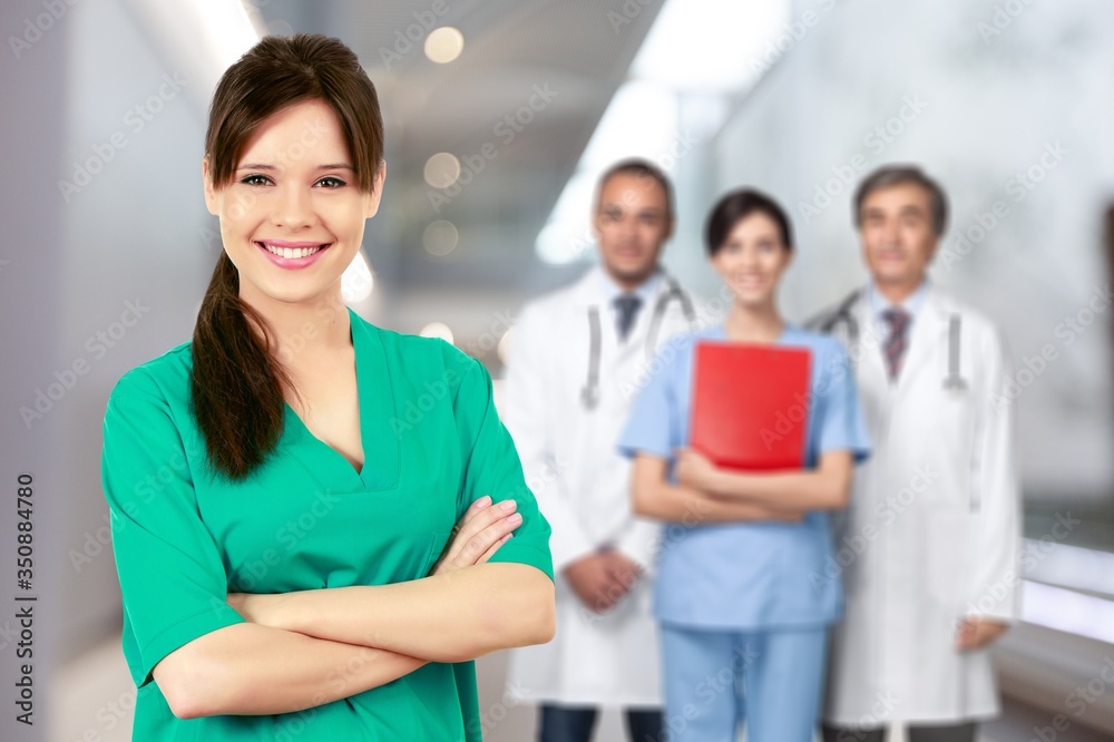 Beautiful young woman doctor smiling in work uniform Beautiful young woman doctor smiling in work uniform