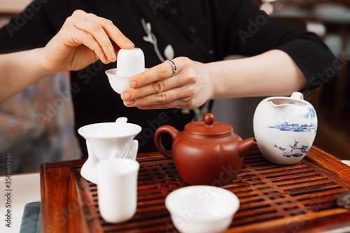 Chinese tea ceremony. Girl making chinese tea
