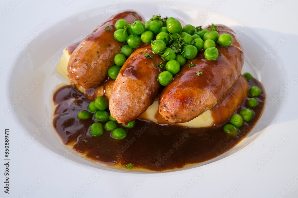 Sausages and mashed potatoes with green peas and gravy Sausages and mashed potatoes with green peas and gravy