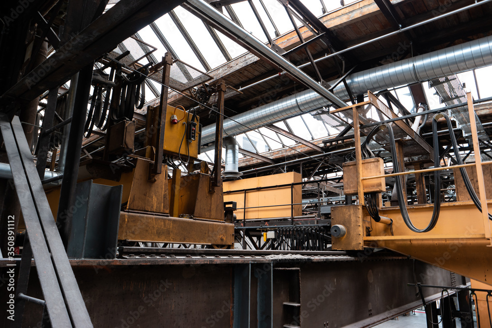 Old disabled heavy industry factory machinery inside low angle shot Old disabled heavy industry factory machinery inside low angle shot
