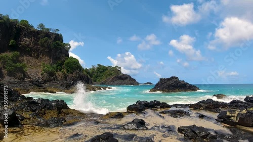 Beach and coral of Baía dos Porcos in Fernando de Noronha Island Brazil.