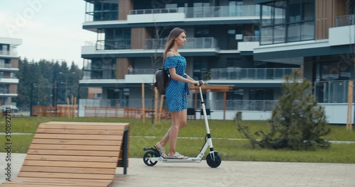 woman riding on electric kick scooter