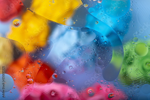 Mixing water and oil drops. Macro Colorful background. Fluid gradient inks modern creative design