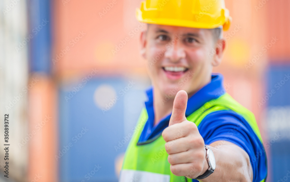 Cheerful engineer man smiling with giving thumbs up as sign of Success Cheerful engineer man smiling with giving thumbs up as sign of Success