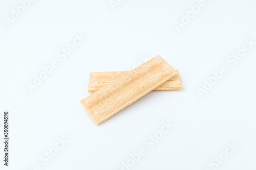 Wafer with white chocolate on white background