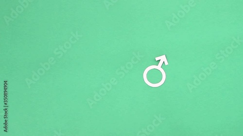 hand puts and shows three paper genders: male, female and transgender photo