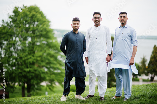 Group of pakistani man wearing traditional clothes salwar kameez or kurta. photo