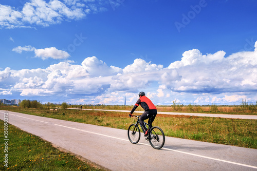Athlete on a Bicycle on the background of a natural landscape. Good sports Cycling equipment.
