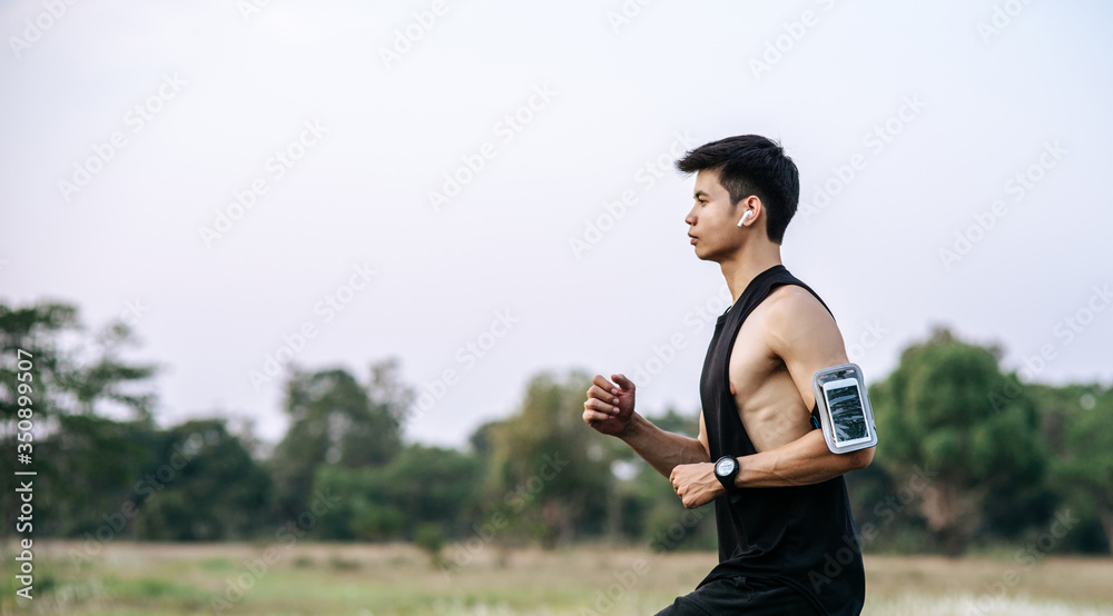 Men and women exercise by running on the road. Men and women exercise by running on the road.