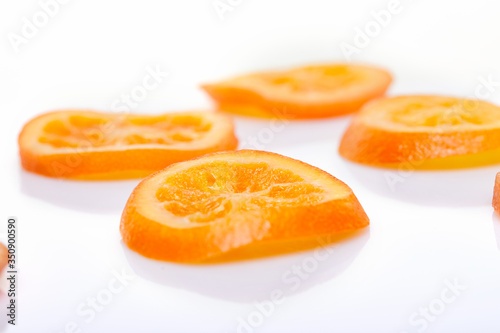 Slices Dried oranges or tangerines isolated on a white background. Vegetarianism and healthy eating