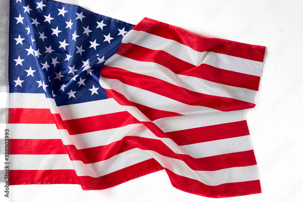 Fototapeta premium Close up of ruffled American flag. Satin texture curved flag of USA. Memorial Day or 4th of July. Banner, freedom concept